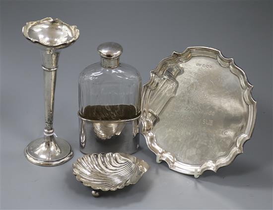 A mid 20th century silver waiter, a silver mounted flask with plated cup, a silver spill vase and a silver butter dish.